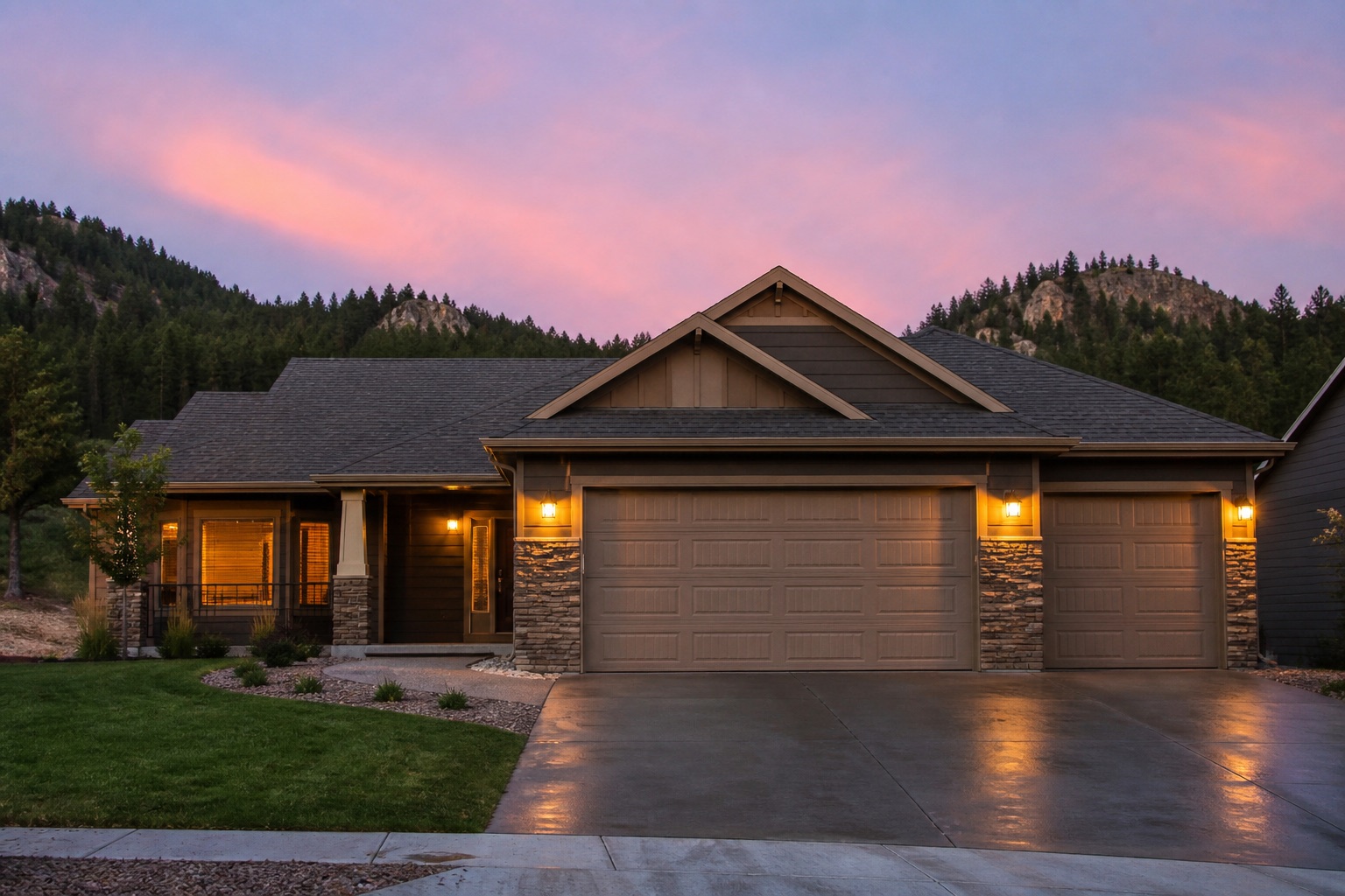 Residential garage doors on a Rapid City–area home at dusk